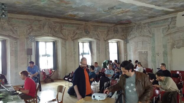 Main room for the hackathon held at the public library of Trento, Italy, during the Spaghetti Open Data Reunion 2016. Photo credit: Hjfocs, CC-BY.SA 4.0 https://commons.wikimedia.org/wiki/File:Spaghetti_Open_Data_Reunion_2016_Hackathon_02.jpg